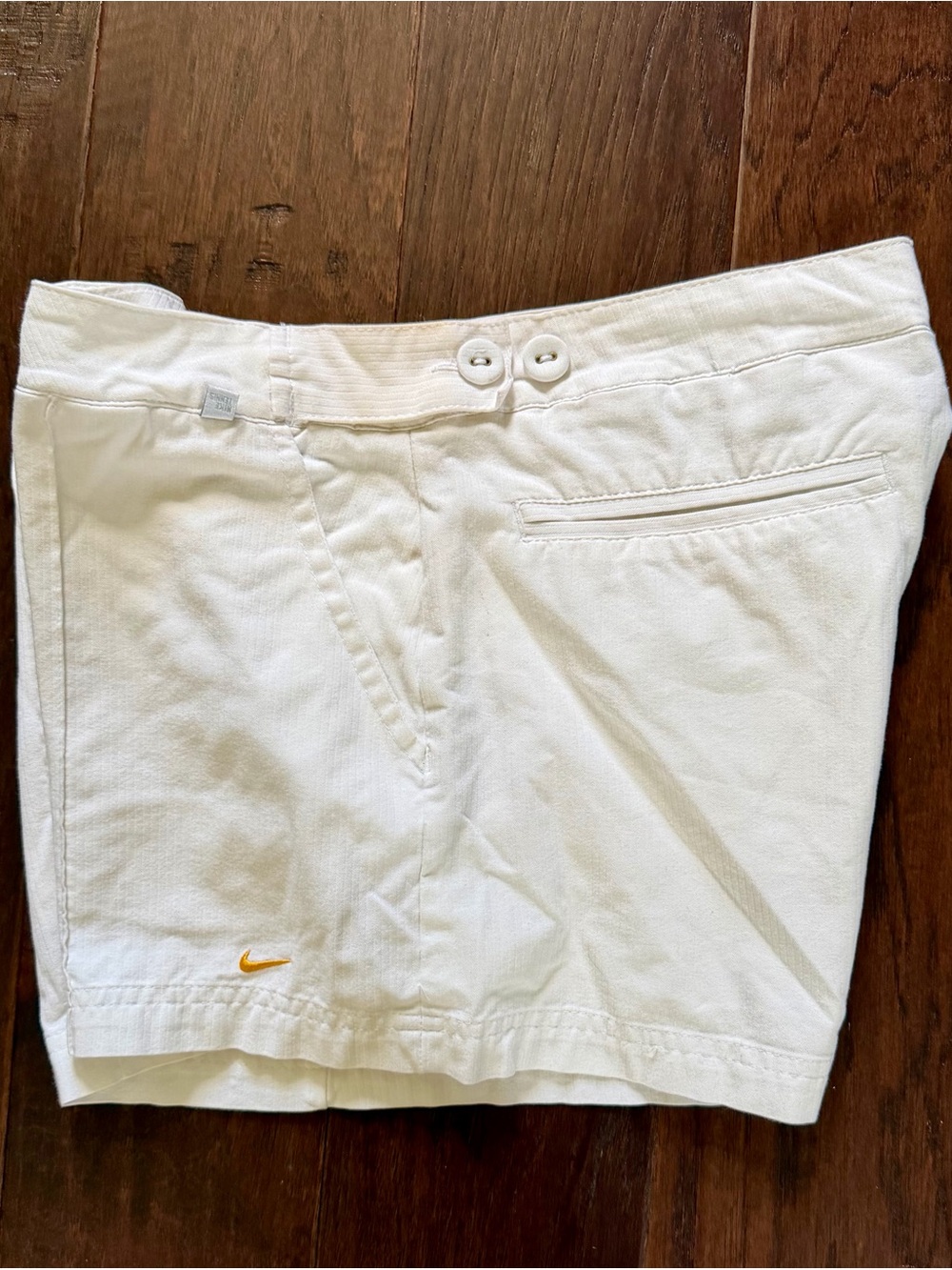 Nike Eggshell colored Women’s Golf Shorts with Gold Swoosh
